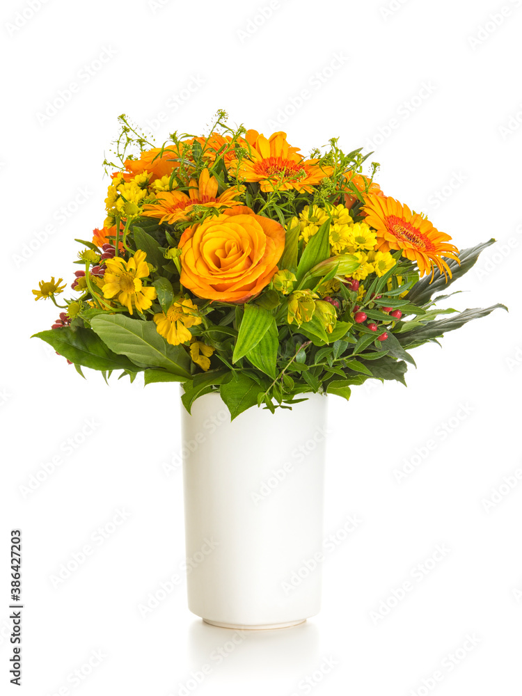 Autumnal flowers bouquet in vase isolated on white background