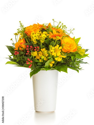Autumnal flowers bouquet in vase isolated on white background © eyewave