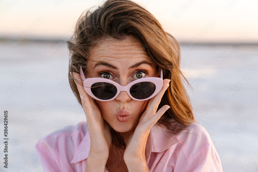 Surprised shocked young girl in sunglasses Surprised shocked young girl in sunglasses