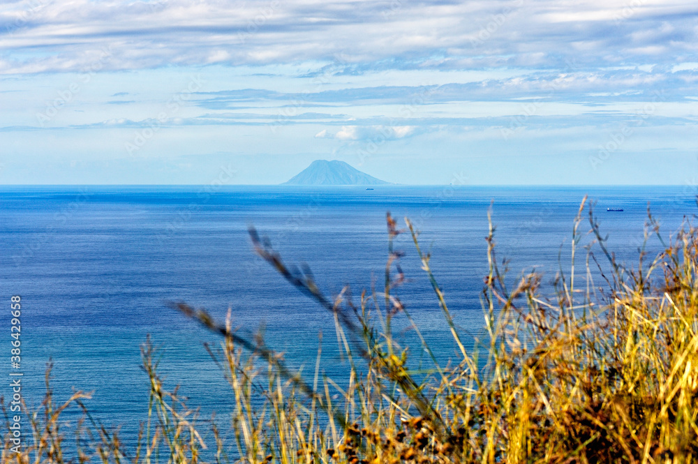 The island of Stromboli seen from the Costa Viola, Palmi, Reggio Calabria district, Calabria, Italy, Europe