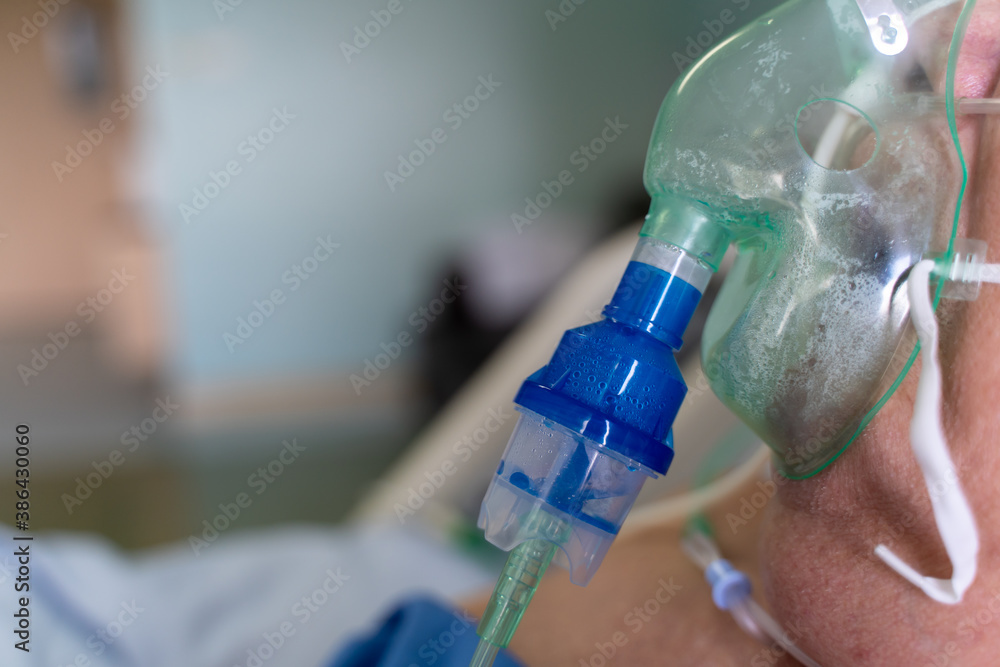 A old man patient in the hospital with oxygen mask