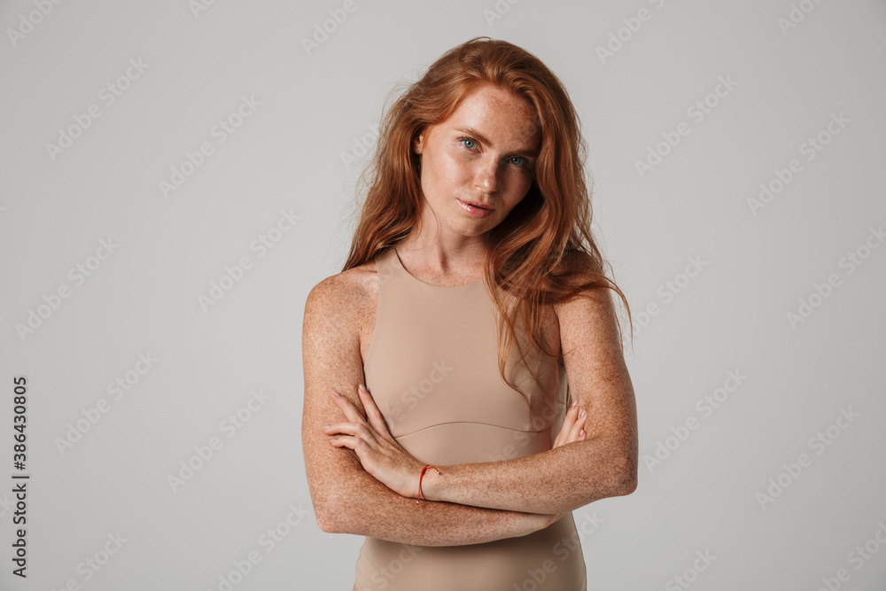 Beautiful young woman with long red hair in bodysuit Beautiful young woman with long red hair in bodysuit