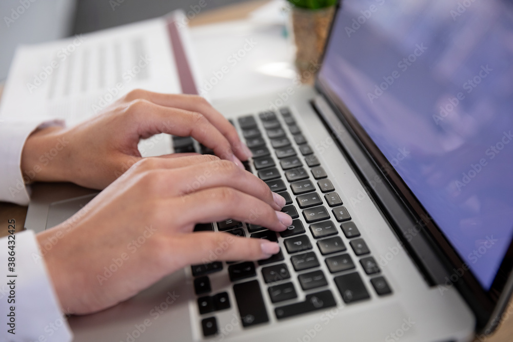 Close up view of Businesswoman using laptop Close up view of Businesswoman using laptop
