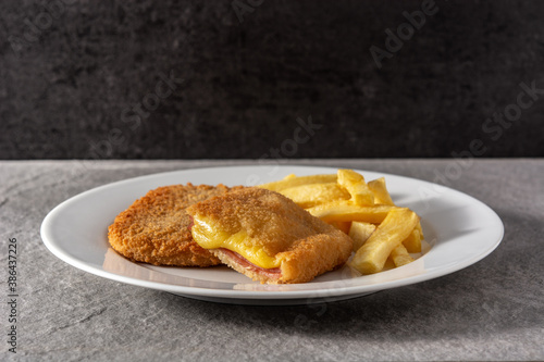 San Jacobo steak filled with cheese and ham on gray stone photo