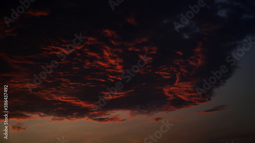 Dusk with orange clouds exposed to the sun © tarasari