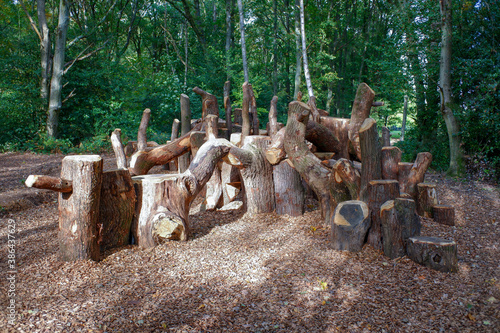 Natural play area or woodland den constructed with sustainably felled oak tree trunks on Chorleywood Common, Hertfordshire, England, UK
