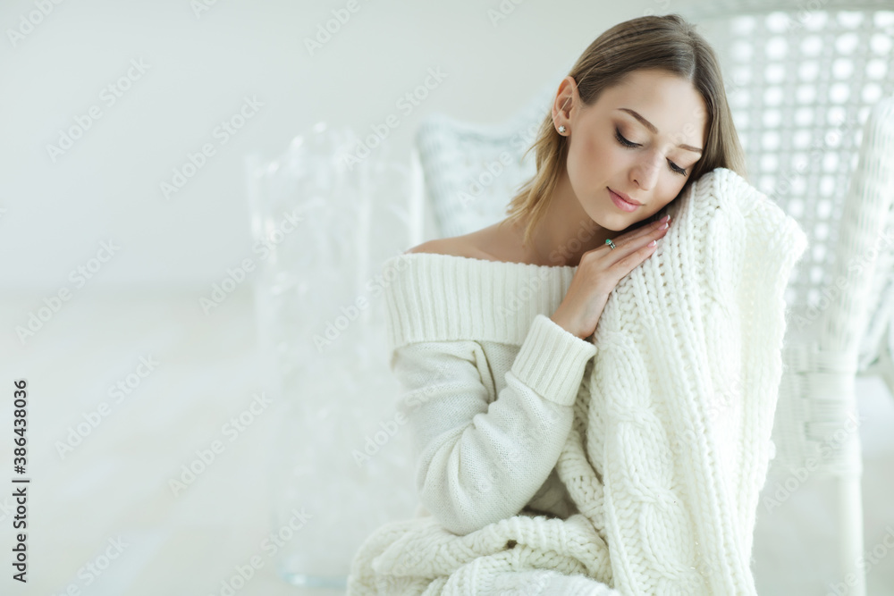 Young woman relaxing with chunky wool blanket. Relax, comfort lifestyle. Winter style. High quality photo. Young woman relaxing with chunky wool blanket. Relax, comfort lifestyle. Winter style. High quality photo.