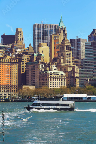 View from Ferry on Pier A in the Hudson River and Battery Park of Lower Manhattan, New York, USA.