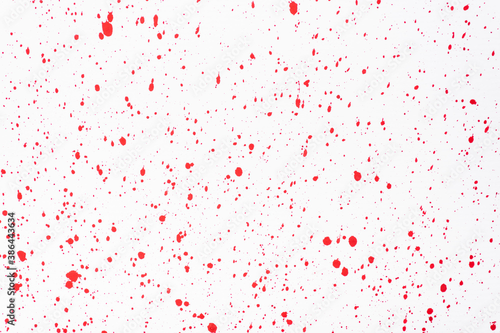 top view of abstract red paint stains on white background
