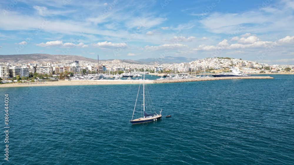 Aerial drone photo of beautiful luxury sailboat with wooden deck anchored near famous marina of Zea, Piraeus, Attica, Greece