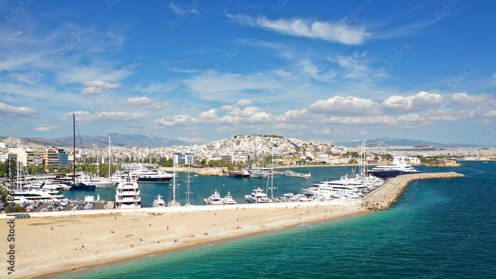 Obraz premium Aerial drone panoramic photo of iconic round port and marina of Zea in the heart of Piraeus with beautiful sky and clouds, Attica, Greece
