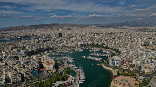 Aerial drone panoramic photo of iconic round port and marina of Zea in the heart of Piraeus with beautiful sky and clouds  Attica  Greece