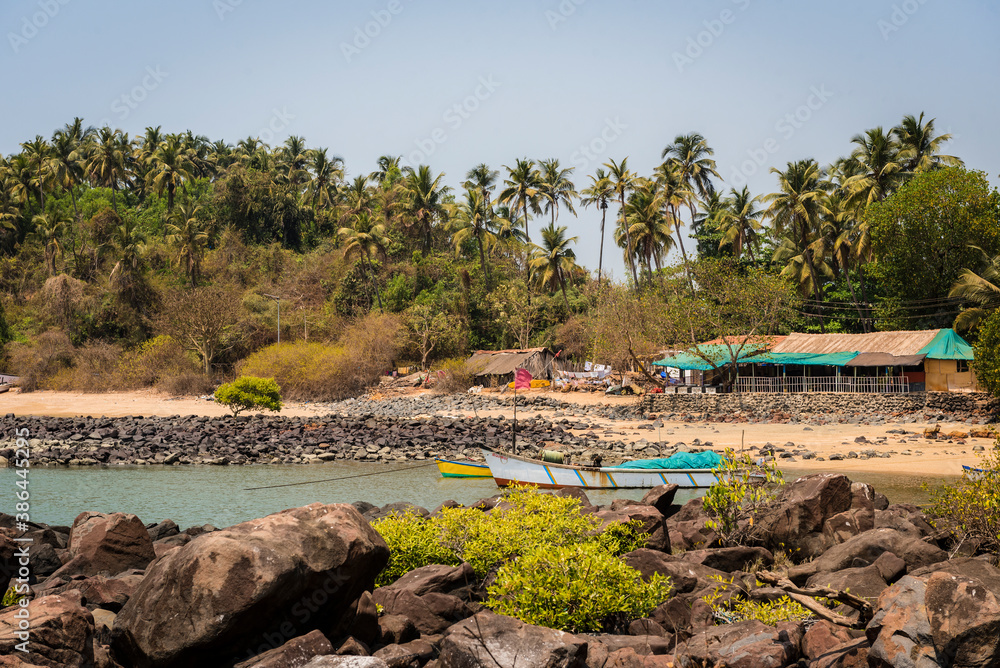 Fishing boats in a lagoon near a village in Goa, India Fishing boats in a lagoon near a village in Goa, India