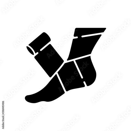 Elastic bandage black glyph icon. Suffer from injury. Hurt foot. Join trauma treatment. Medical equipment to help patient. Health care. Silhouette symbol on white space. Vector isolated illustration