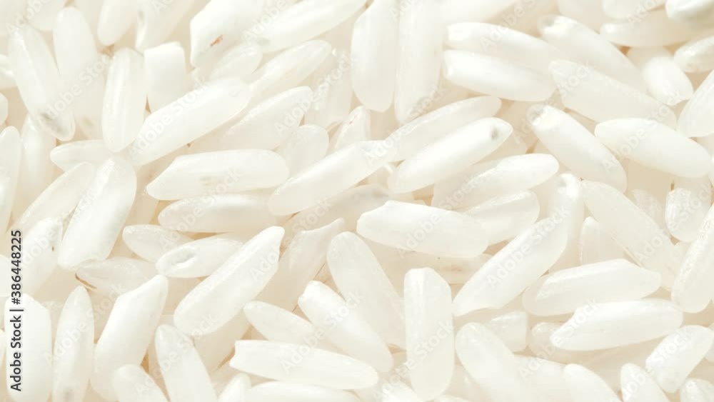 Macro white raw rice texture, food background, vegetarian healthy eating product Macro white raw rice texture, food background, vegetarian healthy eating product