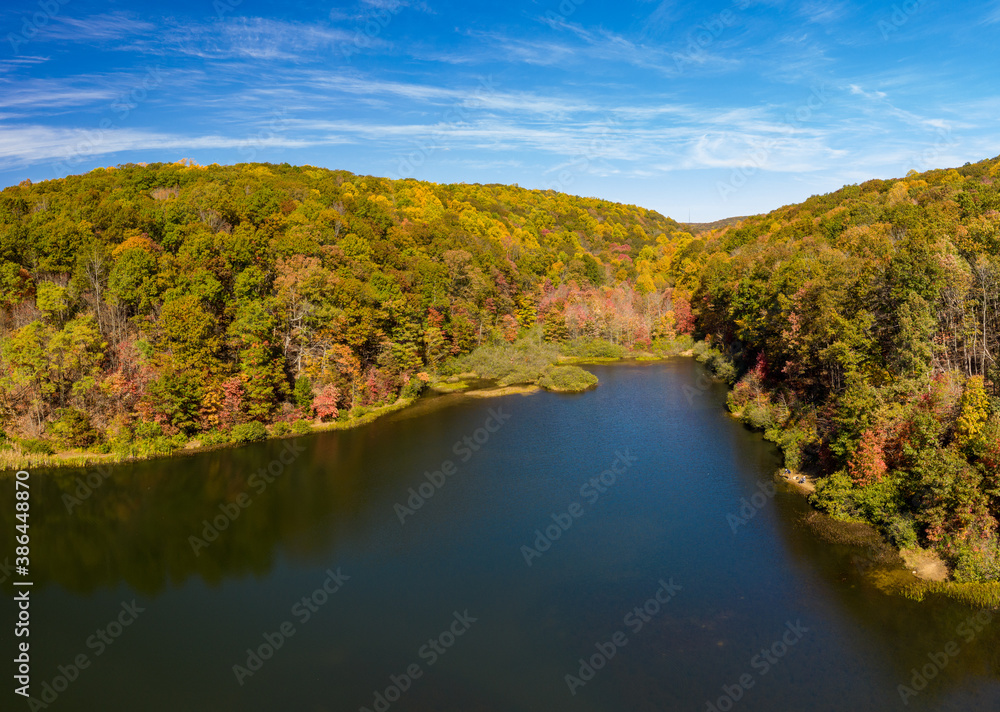 Aerial drone image of the Coopers Rock Lake and Glade Run in the state park in the autumn. Located near Morgantown WV