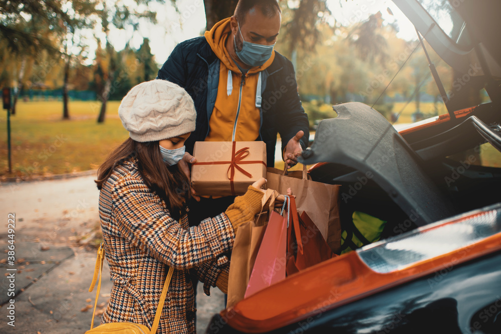 Family shopping Christmas gifts during COVID19 pandemic. They wears a
