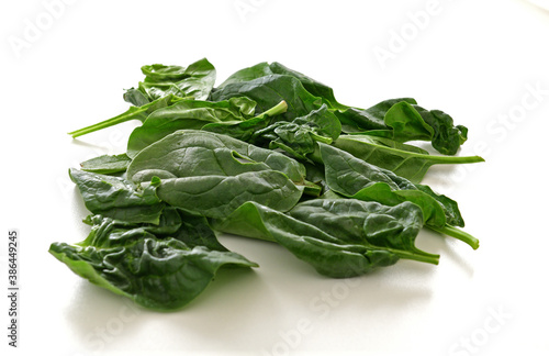 Spinach (Spinacia oleracea) leaves on table