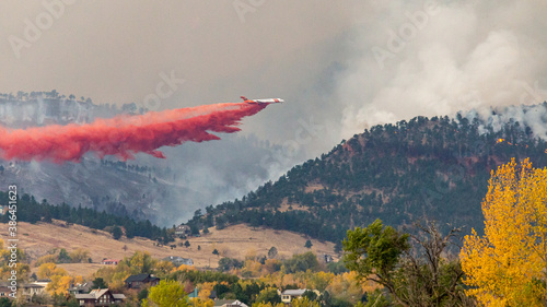 Air tankers drop firefighting retardant on the Cal Wood Fire northwest of Boulder, Colorado.