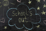Text School's Out and drawings on black chalkboard. Summer holidays