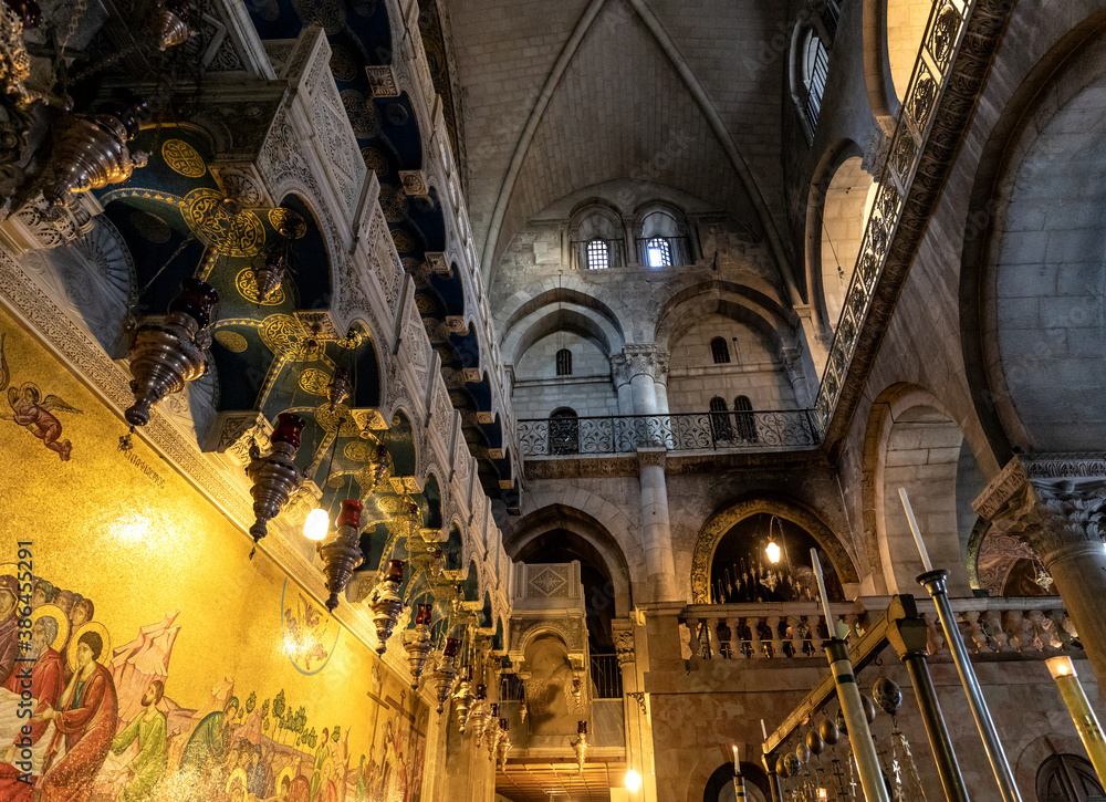Church of the Holy Sepulchre interior, main entrance hall with cloisters of Calvary or Golgotha Chapel in Christian Quarter of historic Old City of Jerusalem, Israel