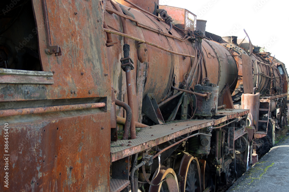 Old rusty steam locomotive. Vintage railroad