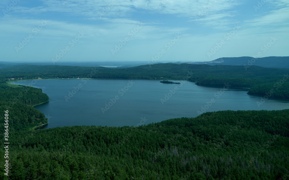 Summer landscape with lake, hills and forest