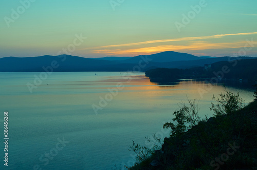 View to lake with mountain range on another shore