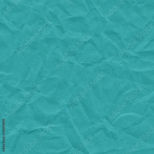 Blue vintage and old looking crumpled paper background. Retro cardboard texture. Grunge paper for drawing. Ancient book page. Present wrapping.