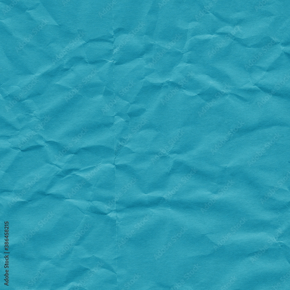 Obraz premium Blue vintage and old looking crumpled paper background. Retro cardboard texture. Grunge paper for drawing. Ancient book page. Present wrapping.
