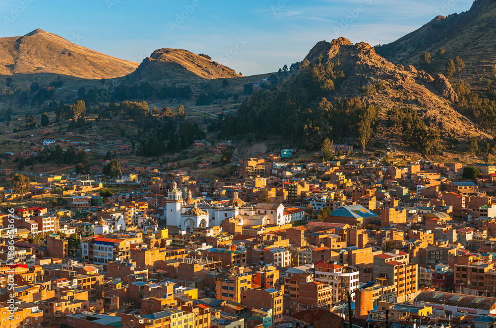 Aerial cityscape of Copacabana at sunset with the Our Lady of Copacabana Basilica, Bolivia.
