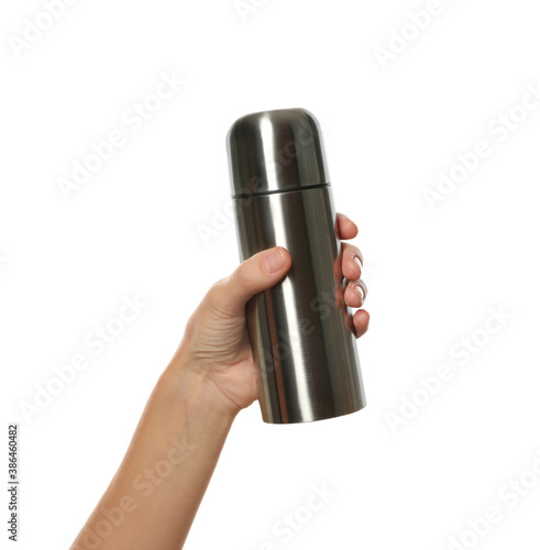 Woman holding silver thermos on white background, closeup