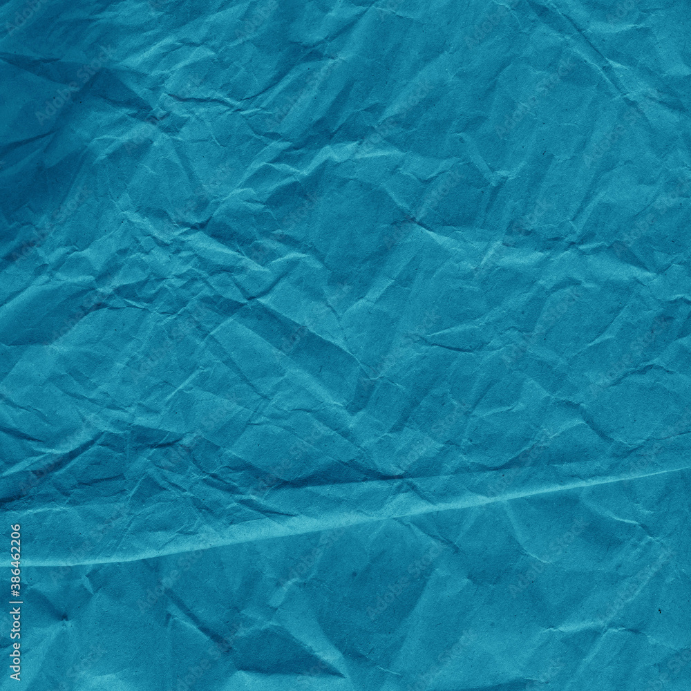 Obraz premium Blue vintage and old looking crumpled paper background. Retro cardboard texture. Grunge paper for drawing. Ancient book page. Present wrapping.