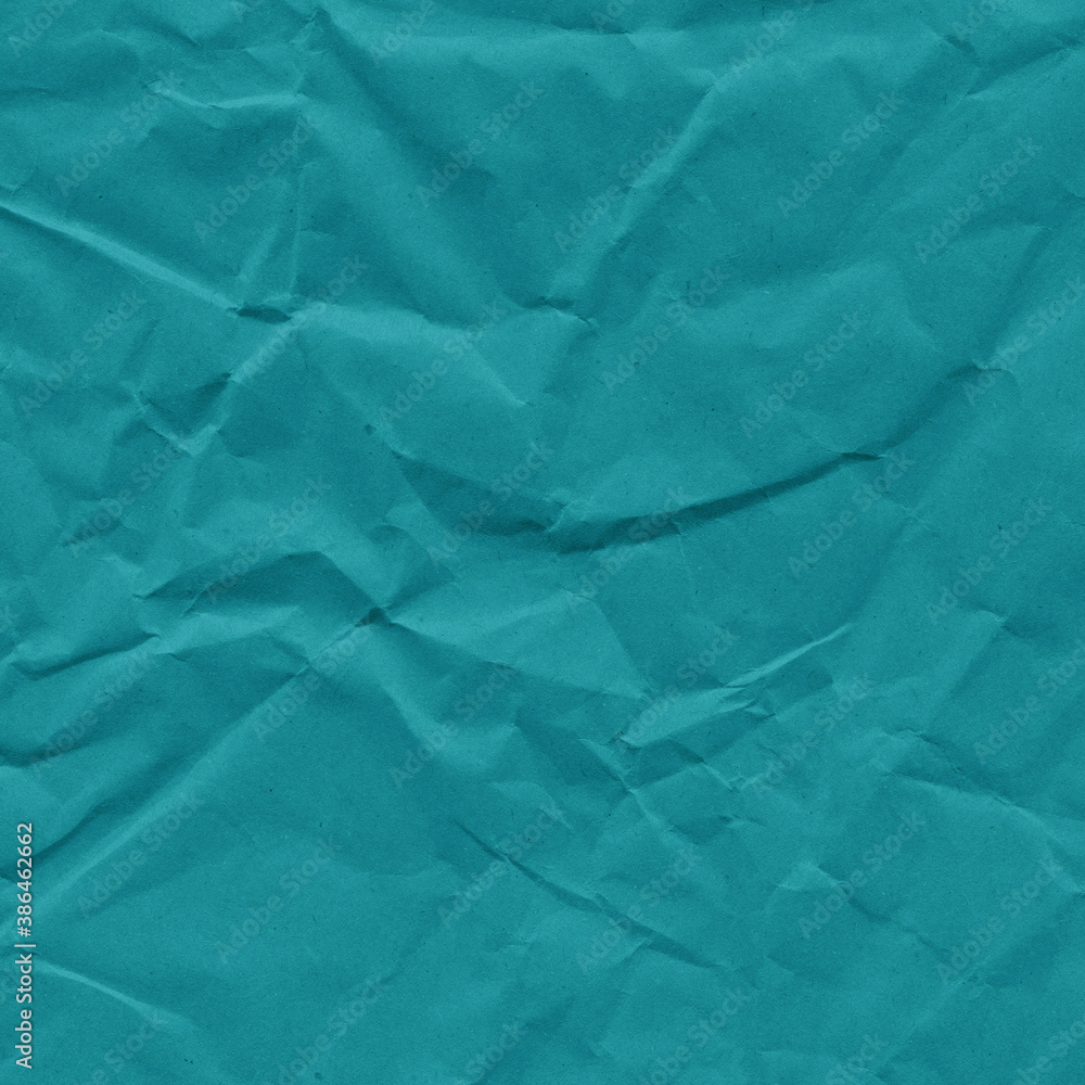 Blue vintage and old looking crumpled paper background. Retro cardboard texture. Grunge paper for drawing. Ancient book page. Present wrapping.