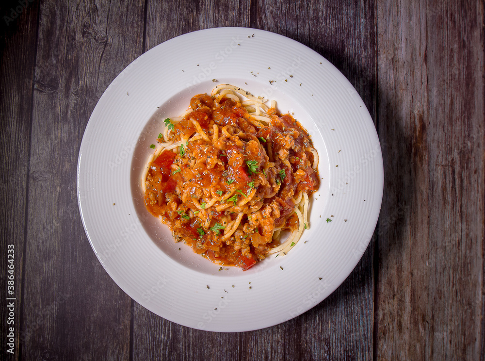 Delicious spaghetti served on a white plate Delicious spaghetti served on a white plate