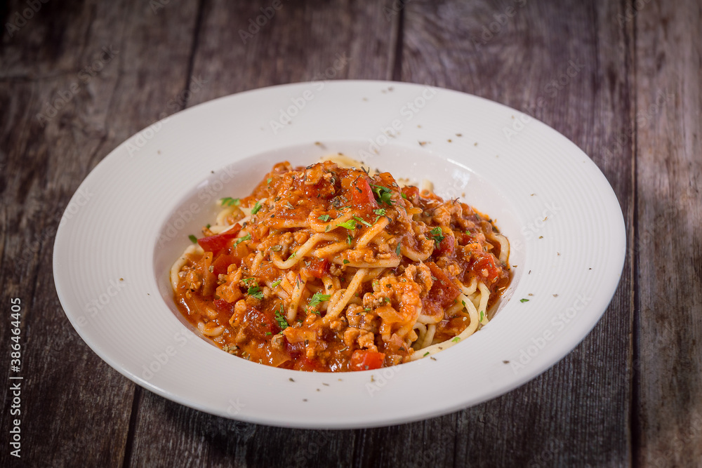 Delicious spaghetti served on a white plate Delicious spaghetti served on a white plate