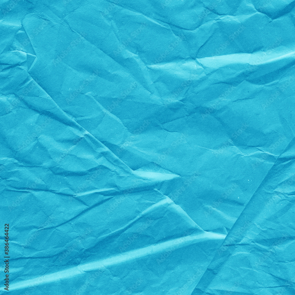 Fototapeta premium Blue vintage and old looking crumpled paper background. Retro cardboard texture. Grunge paper for drawing. Ancient book page. Present wrapping.