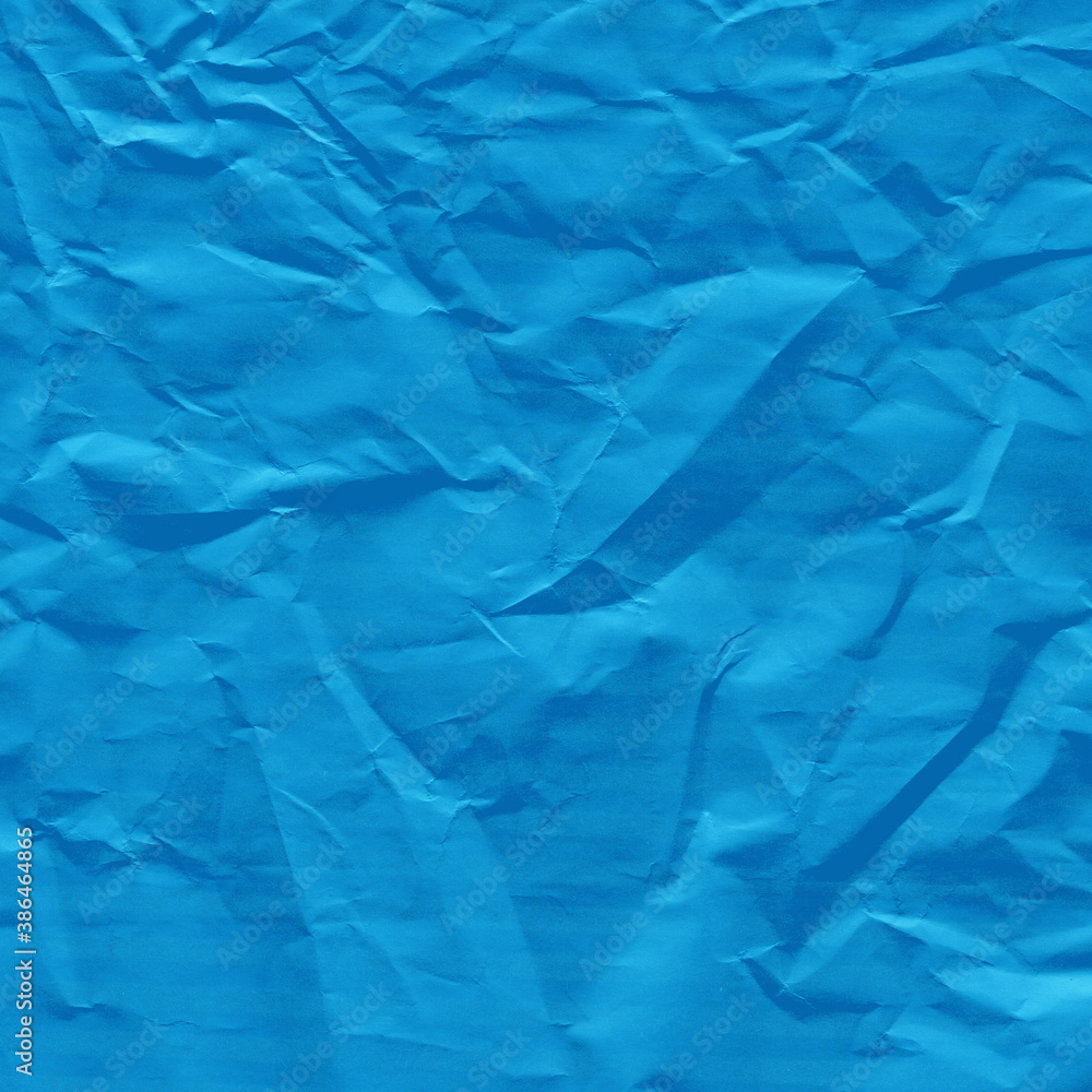 Obraz premium Blue vintage and old looking crumpled paper background. Retro cardboard texture. Grunge paper for drawing. Ancient book page. Present wrapping.