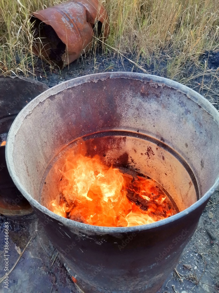 Fire in an old barrel on the street. Fire in an old barrel on the street.