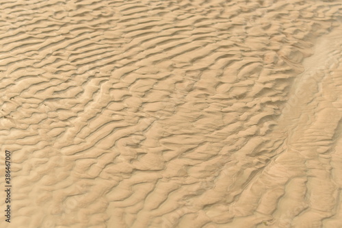 The texture of the sand by the ocean