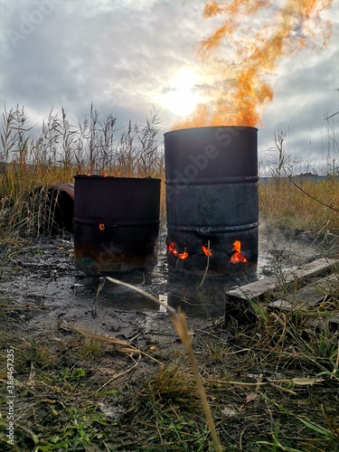 Fire in an old barrel on the street.