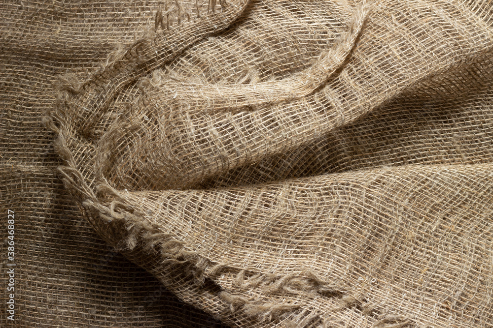 Texture of crumpled natural burlap close-up. Texture of crumpled natural burlap close-up.