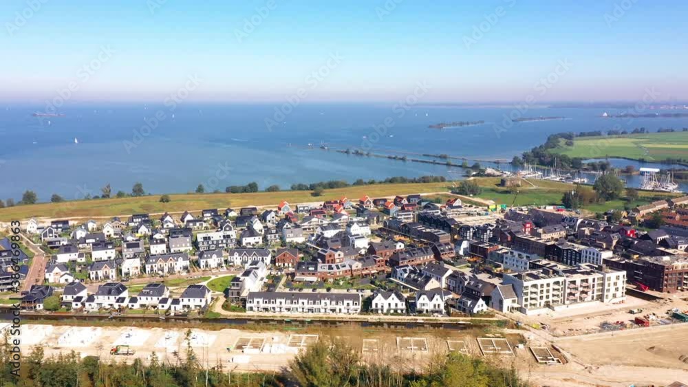 Muiden, Noord-Holland / Netherlands - October 10th 2020: Aerial view of the new housing estate in Muiden called ‘De Krijgsman’. Muiden, Noord-Holland / Netherlands - October 10th 2020: Aerial view of the new housing estate in Muiden called ‘De Krijgsman’.