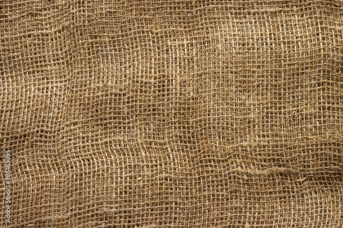 Texture of crumpled natural burlap close-up.