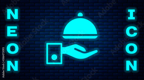 Glowing neon Covered with a tray of food icon isolated on brick wall background. Tray and lid sign. Restaurant cloche with lid. Vector.