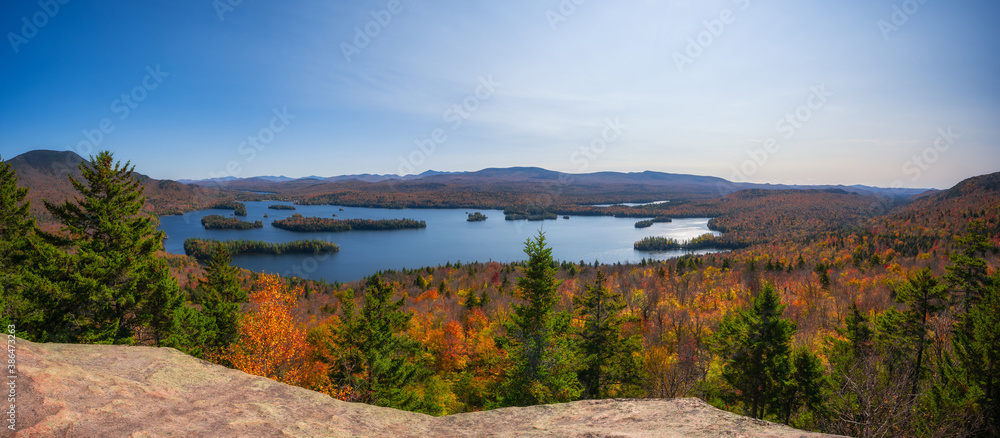 Panorama of the fall foliage and Tupper lake from Castle Rock summit in the Adirondacks New York 