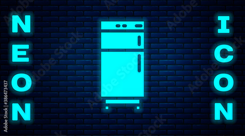 Glowing neon Refrigerator icon isolated on brick wall background. Fridge freezer refrigerator. Household tech and appliances. Vector.