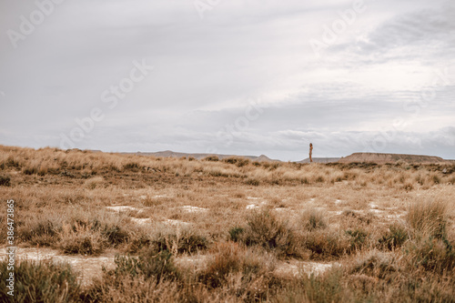 Desertic landscape and a woman