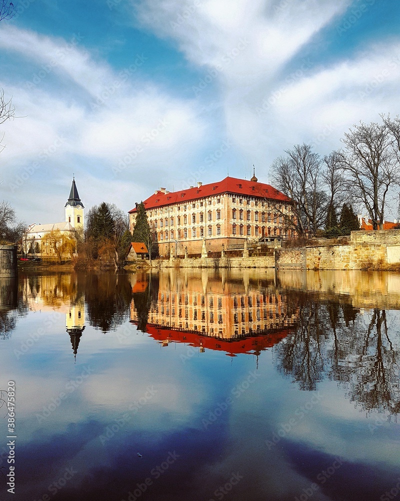 Fototapeta premium Baroque chateau Libochovice, reflection in the river Ohře