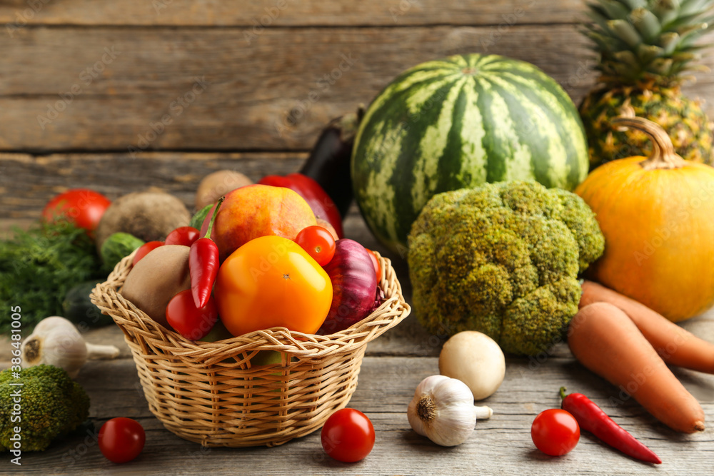Ripe fruits and vegetables on grey wooden table Ripe fruits and vegetables on grey wooden table